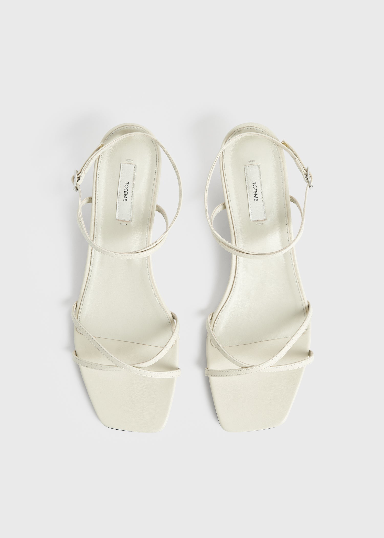 Leather crossover sandals off-white
