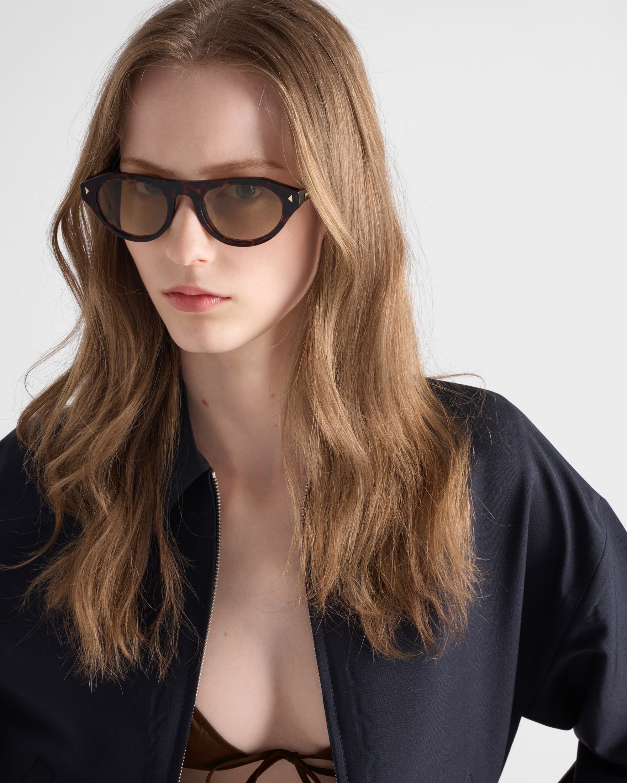 Prada sunglasses with the iconic metal plaque